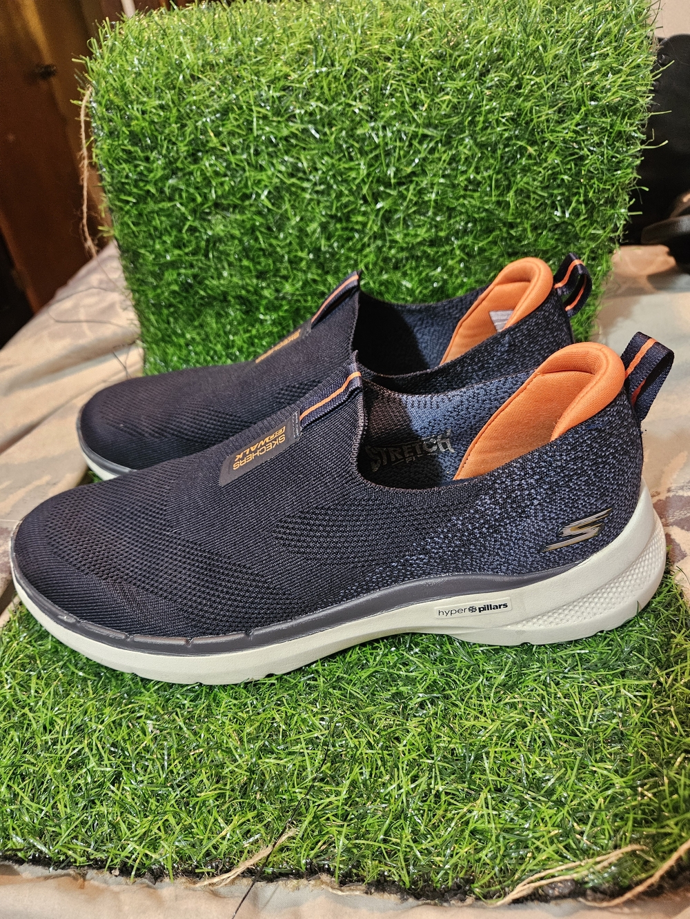 Skechers Men’s Slip-On Sneakers in Navy with Orange Accents